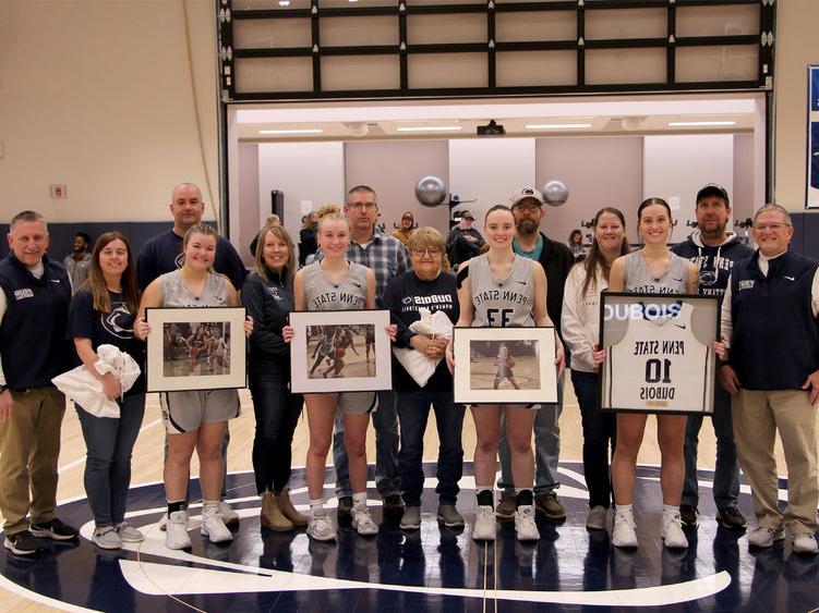 A group photo from the 2025 Penn State DuBois women’s basketball team senior day festivities. Members of the team that were honored are joined by family members and members of the coaching staff.